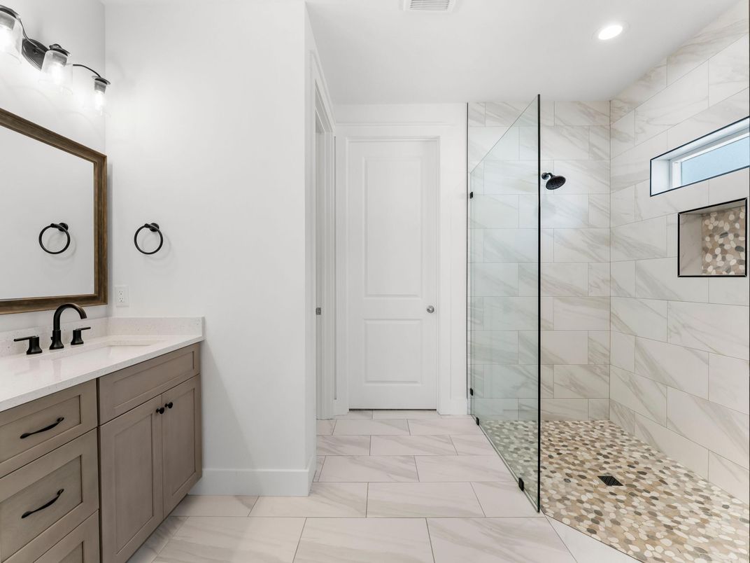 Bathroom, Dual Sink Vanities, Glass Shower, Interior, Marble, Marble Walls, Recessed Lighting