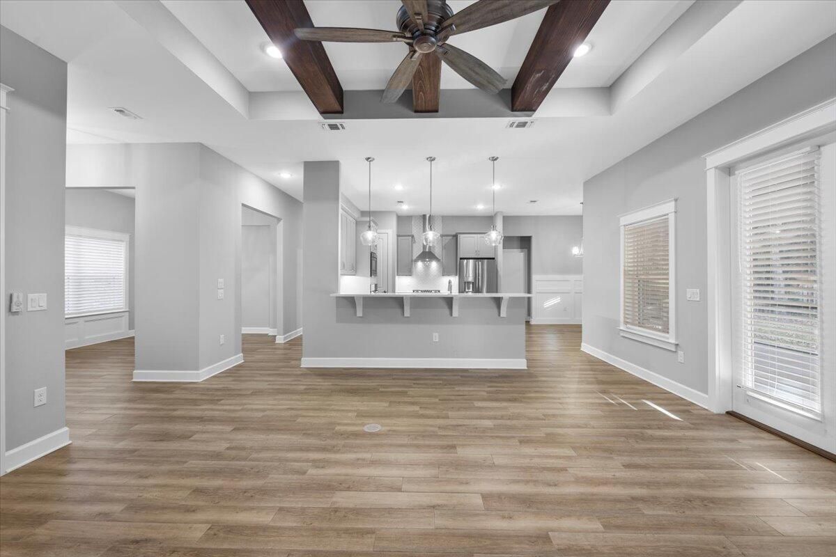 Empty room, Interior, Kitchen, Pendant Lights, Recessed Lighting, Stainless Steel Appliances, Wooden Beams, Wood Texture Flooring