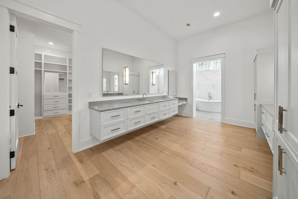Bathroom, Dual Sink Vanities, Free Standing Baths, Interior, Recessed Lighting, Walk-in Closets, Wood Texture Flooring