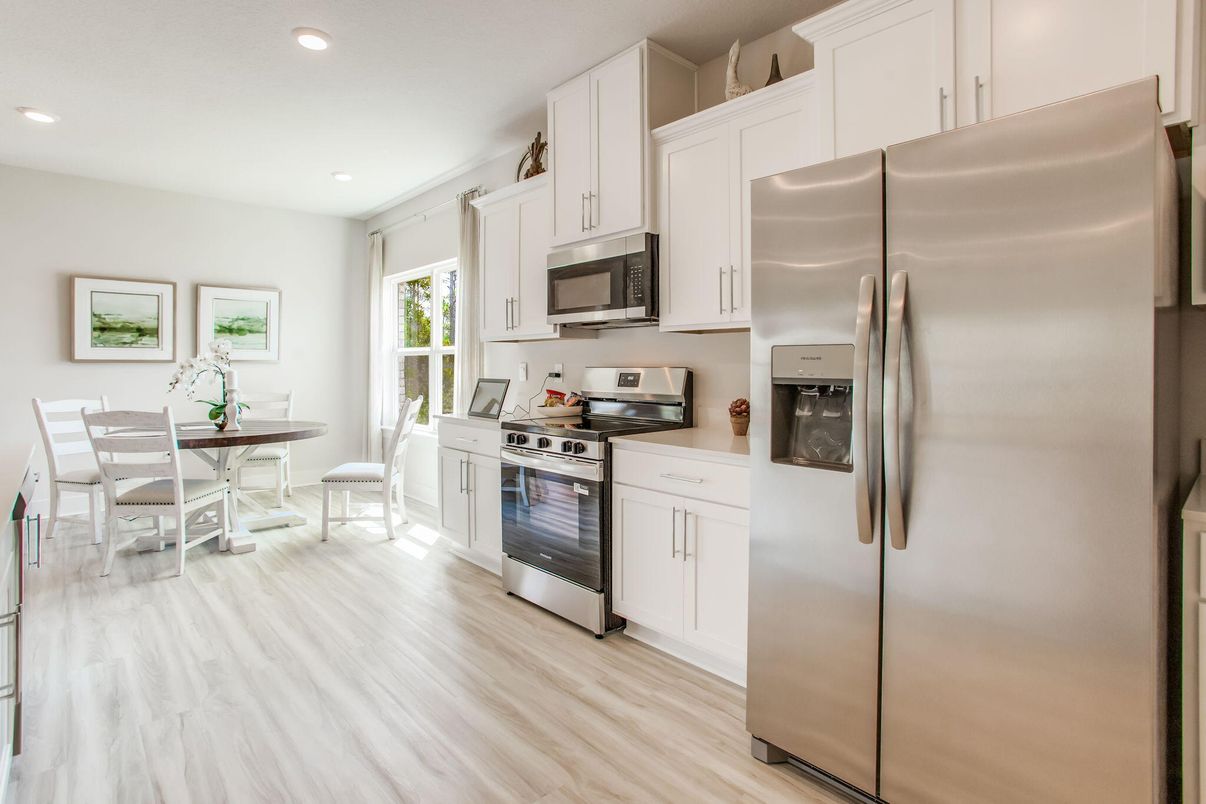 Dining room, Interior, Kitchen, Recessed Lighting, Stainless Steel Appliances, Wood Texture Flooring