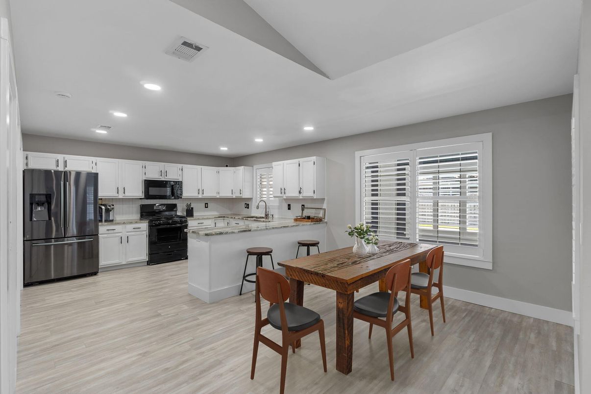 Dining room, Interior, Kitchen, Recessed Lighting, Stainless Steel Appliances, Wood Texture Flooring