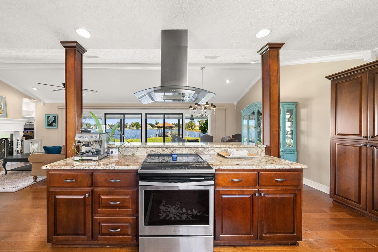 Fireplace, Interior, Kitchen, Recessed Lighting, Stainless Steel Appliances, Wood Texture Flooring