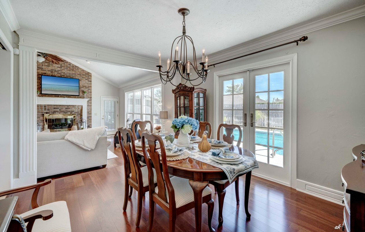 Chandelier, Dining room, Fireplace, Interior, Living room, Stone Walls, Wood Texture Flooring