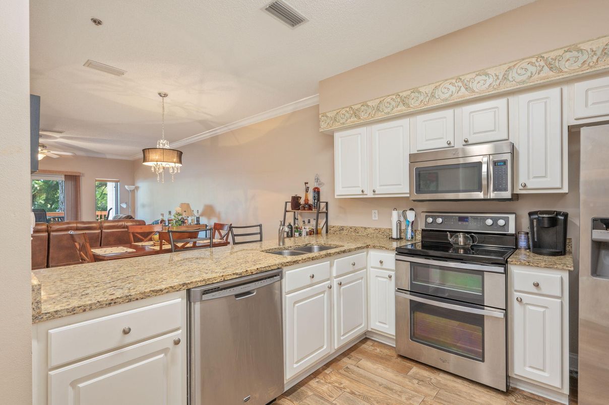 Dining room, Interior, Kitchen, Pendant Lights, Stainless Steel Appliances, Wood Texture Flooring