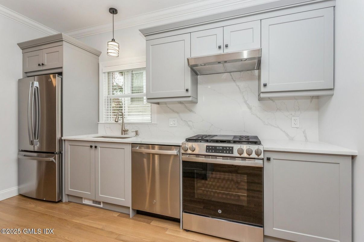 Interior, Kitchen, Marble Walls, Pendant Lights, Stainless Steel Appliances, Wood Texture Flooring