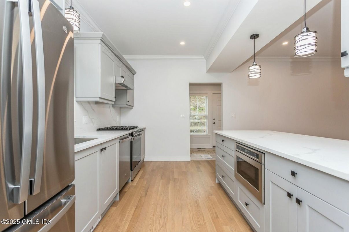 Interior, Kitchen, Pendant Lights, Recessed Lighting, Stainless Steel Appliances, Wood Texture Flooring