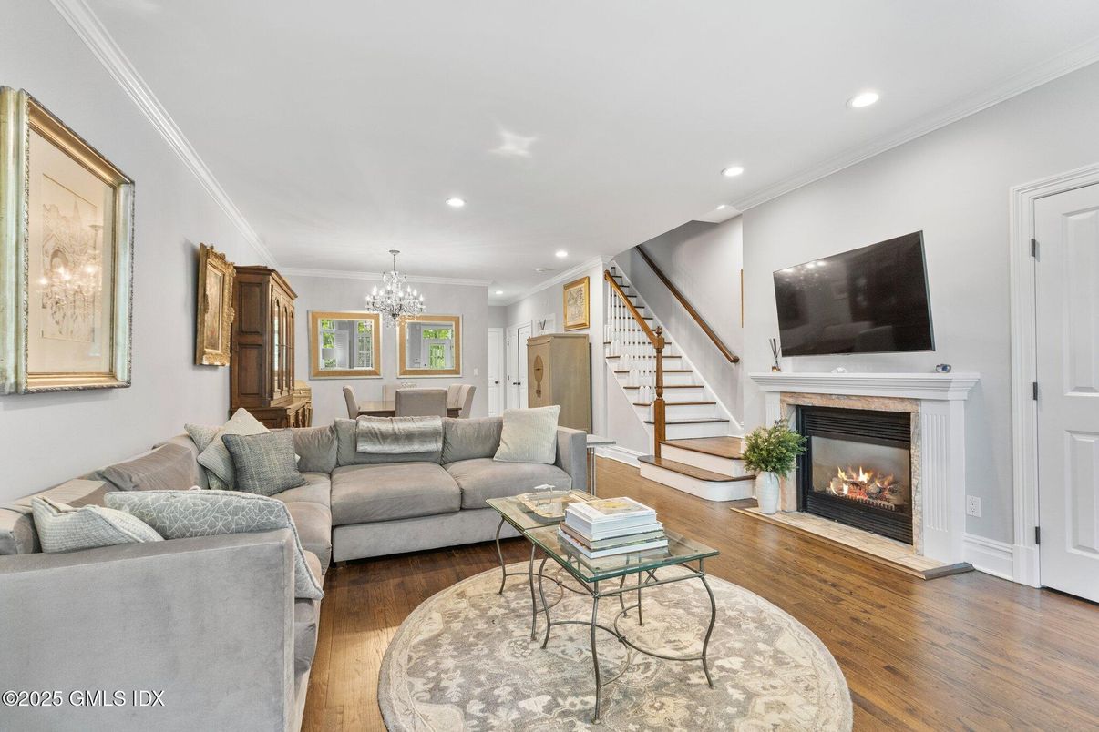 Chandelier, Dining room, Fireplace, Interior, Living room, Recessed Lighting, Wood Texture Flooring