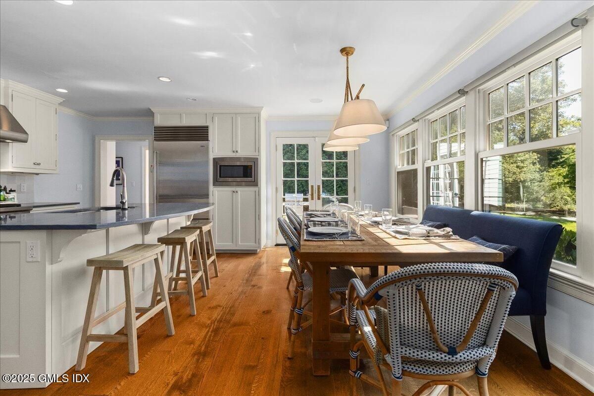 Dining room, Interior, Kitchen, Pendant Lights, Recessed Lighting, Stainless Steel Appliances, Wood Texture Flooring