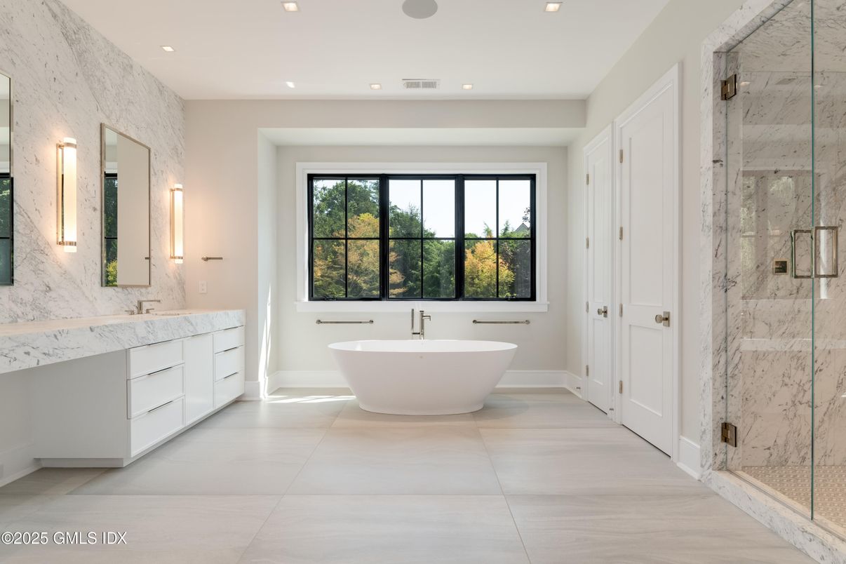 Bathroom, Dual Sink Vanities, Free Standing Baths, Glass Shower, Interior, Marble Walls, Recessed Lighting