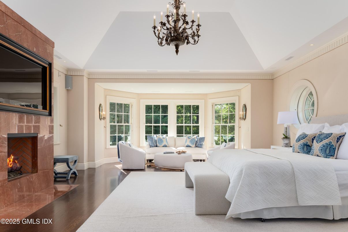 Bedroom, Chandelier, Fireplace, Interior, Recessed Lighting, Wood Texture Flooring