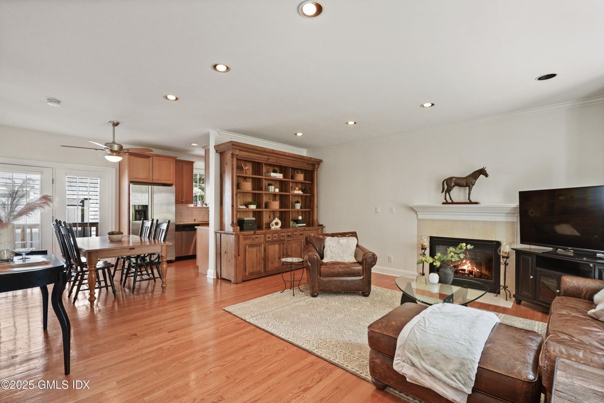 Dining room, Fireplace, Interior, Kitchen, Living room, Recessed Lighting, Stainless Steel Appliances, Wood Texture Flooring