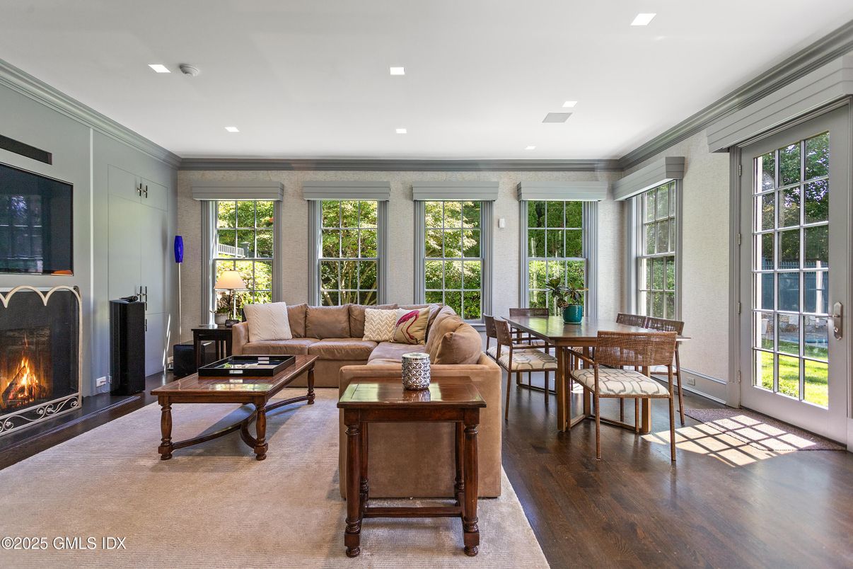 Dining room, Fireplace, Interior, Living room, Recessed Lighting, Wood Texture Flooring
