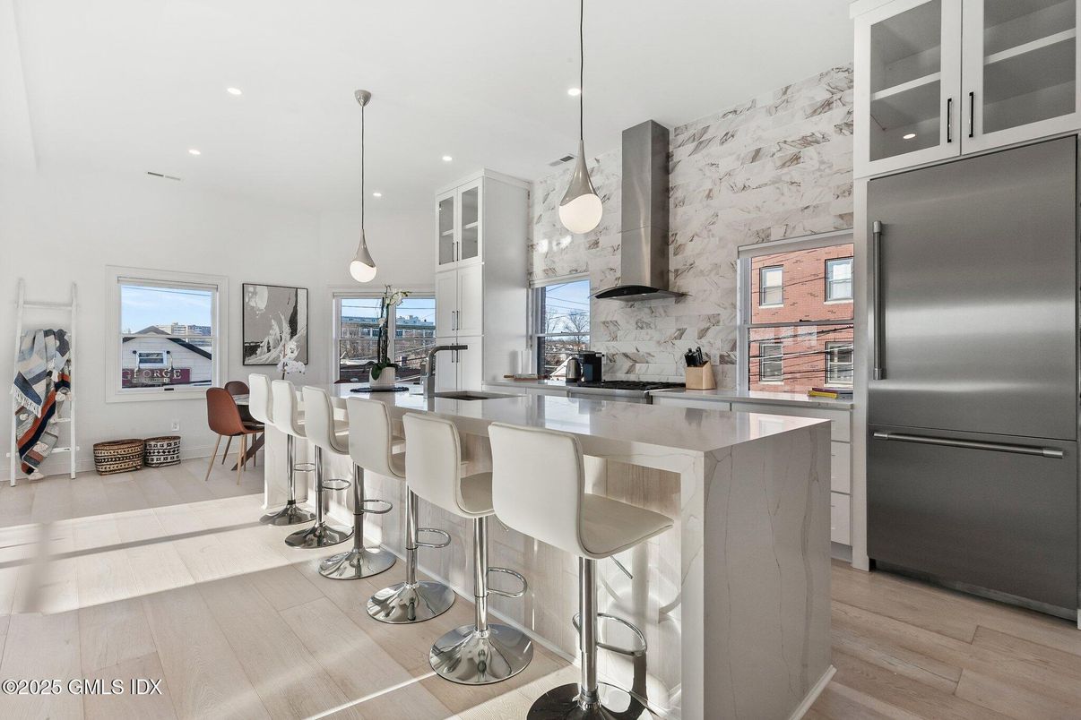 Dining room, Interior, Kitchen, Pendant Lights, Recessed Lighting, Stainless Steel Appliances, Wood Texture Flooring