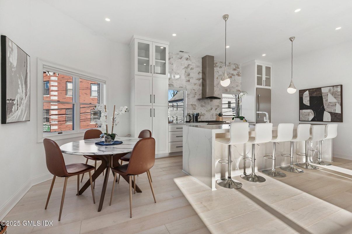 Dining room, Interior, Kitchen, Pendant Lights, Recessed Lighting, Stainless Steel Appliances, Wood Texture Flooring