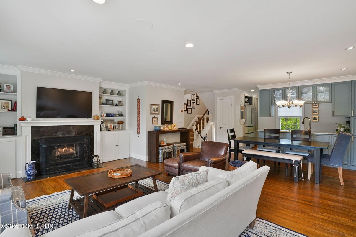 Chandelier, Dining room, Fireplace, Interior, Living room, Recessed Lighting, Wood Texture Flooring