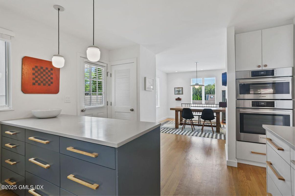 Dining room, Interior, Kitchen, Pendant Lights, Recessed Lighting, Stainless Steel Appliances, Wood Texture Flooring