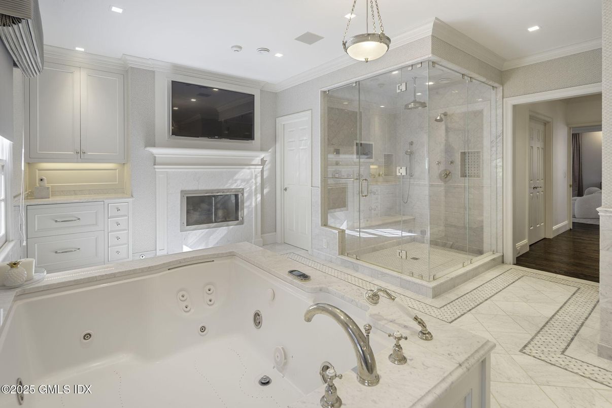 Bathroom, Fireplace, Glass Shower, Interior, Pendant Lights, Recessed Lighting, Wood Texture Flooring