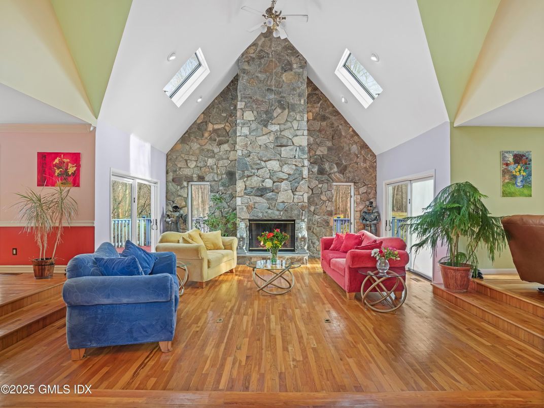 Fireplace, Interior, Living room, Recessed Lighting, Stone Walls, Wood Texture Flooring