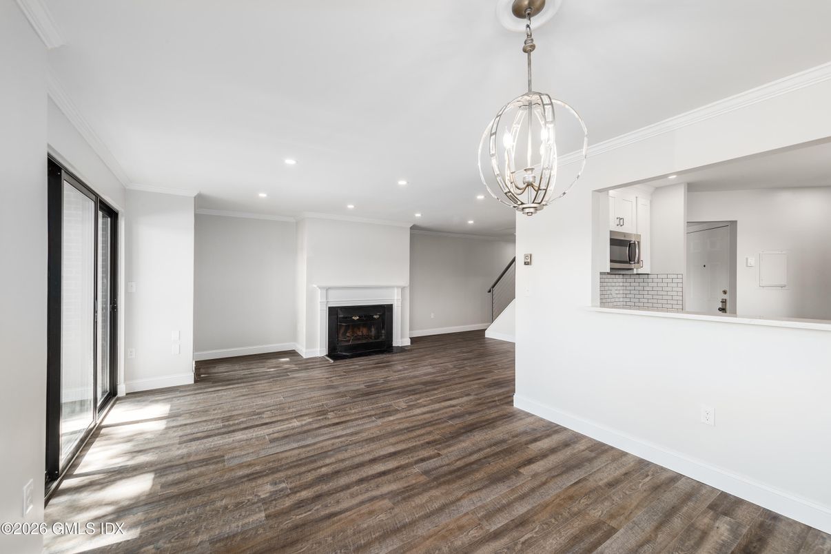Chandelier, Empty room, Fireplace, Interior, Pendant Lights, Recessed Lighting, Wood Texture Flooring