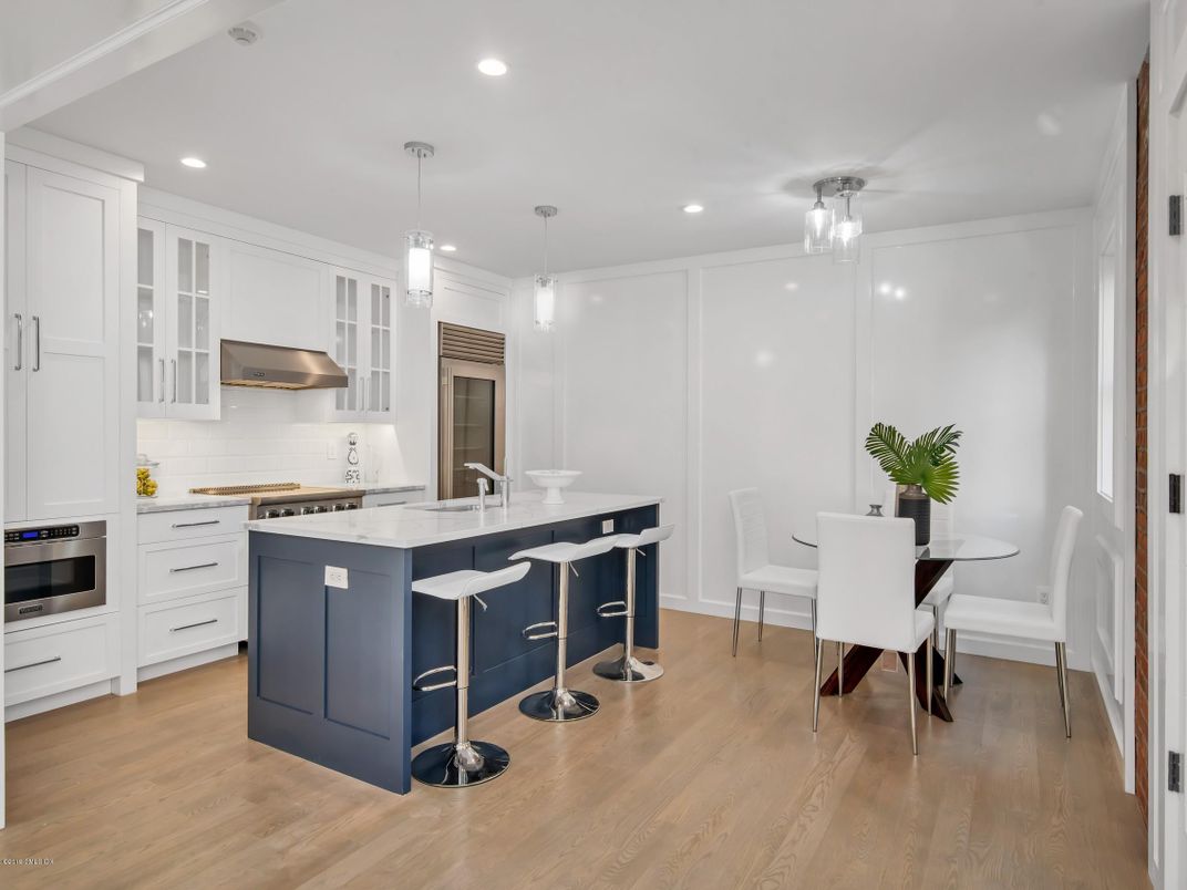 Dining room, Interior, Kitchen, Pendant Lights, Recessed Lighting, Stainless Steel Appliances, Wood Texture Flooring
