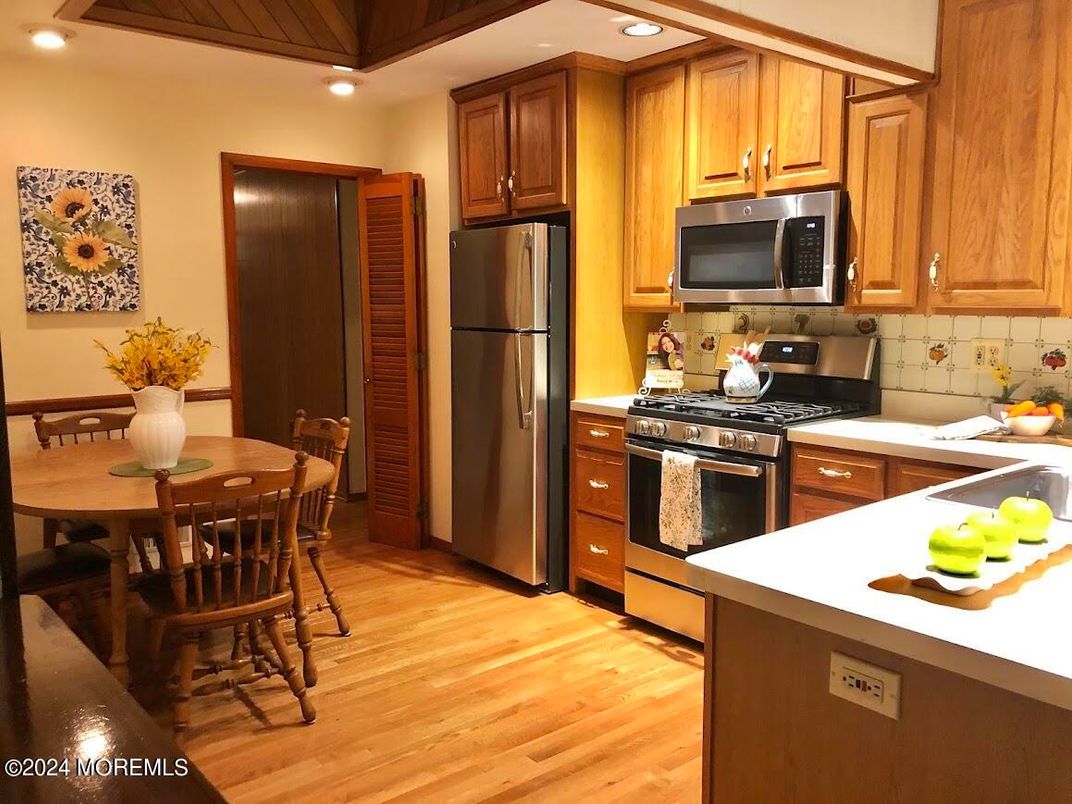Dining room, Interior, Kitchen, Recessed Lighting, Stainless Steel Appliances, Wood Texture Flooring