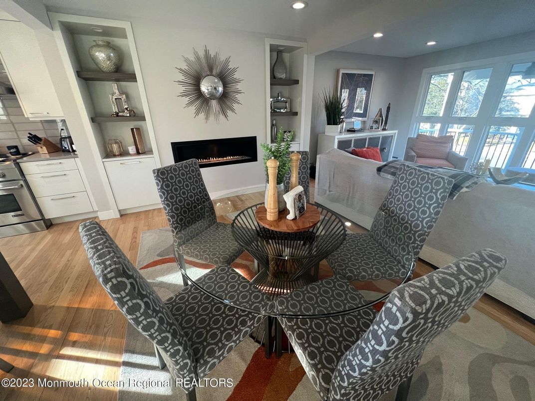 Dining room, Fireplace, Interior, Kitchen, Living room, Recessed Lighting, Wood Texture Flooring