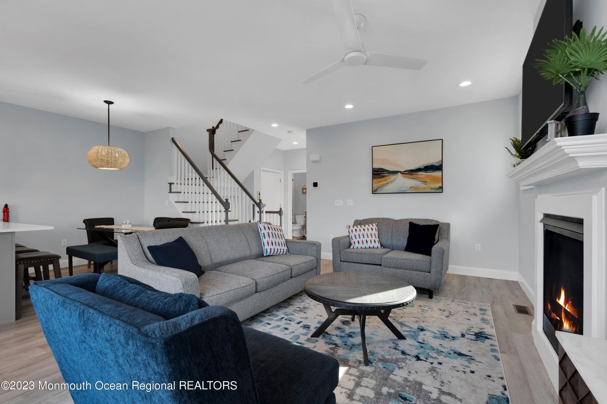 Dining room, Fireplace, Interior, Living room, Pendant Lights, Recessed Lighting, Wood Texture Flooring