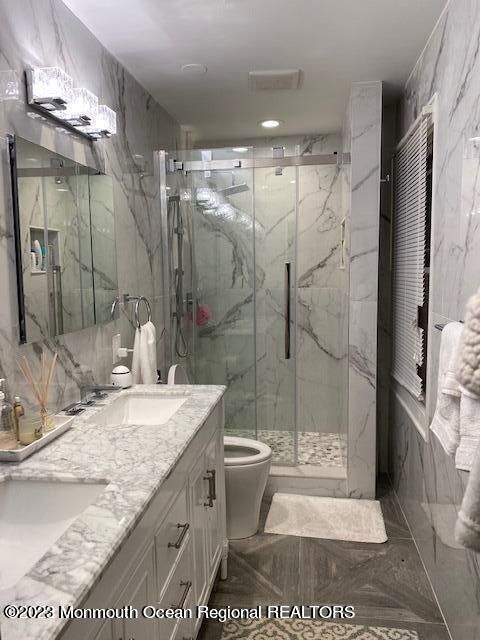 Bathroom, Dual Sink Vanities, Glass Shower, Interior, Marble, Marble Walls, Recessed Lighting