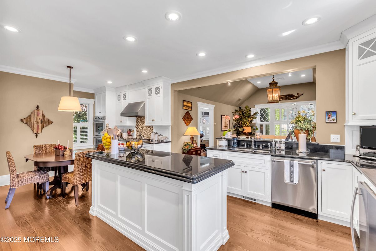 Dining room, Interior, Kitchen, Pendant Lights, Recessed Lighting, Stainless Steel Appliances, Wood Texture Flooring