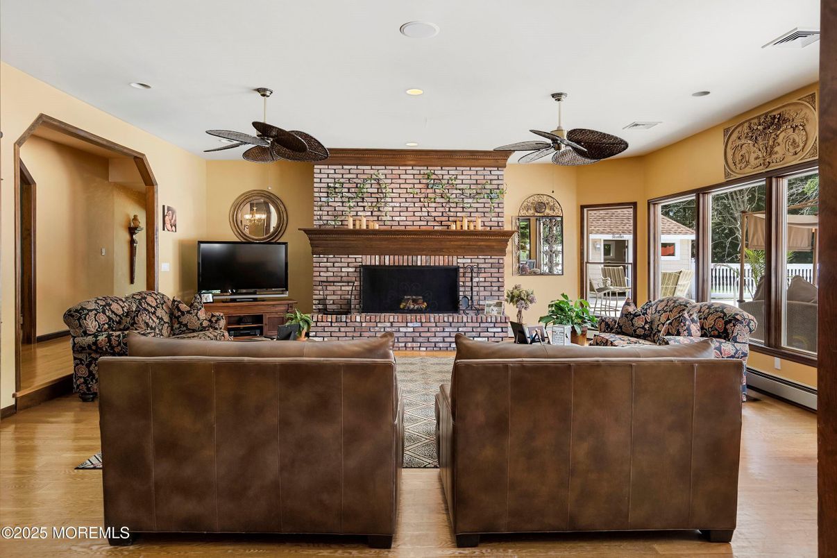 Fireplace, Interior, Living room, Recessed Lighting, Stone Walls, Wood Texture Flooring