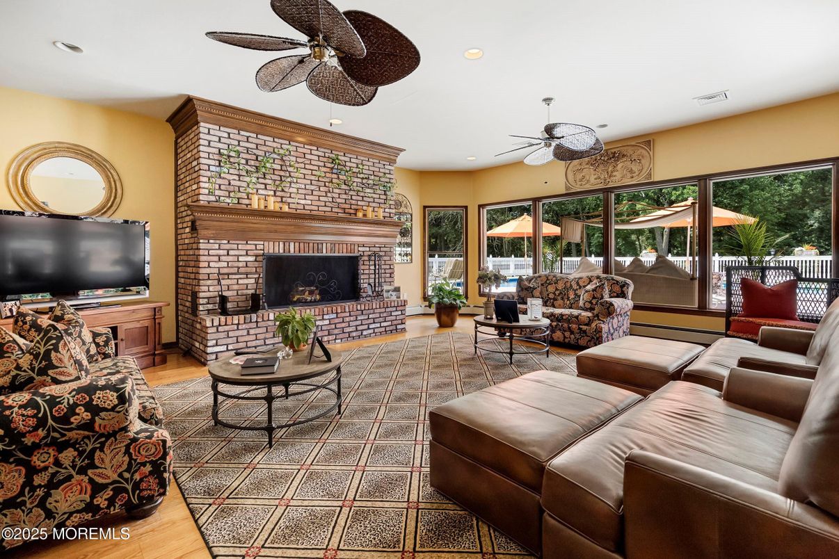 Fireplace, Interior, Living room, Recessed Lighting, Stone Walls, Wood Texture Flooring