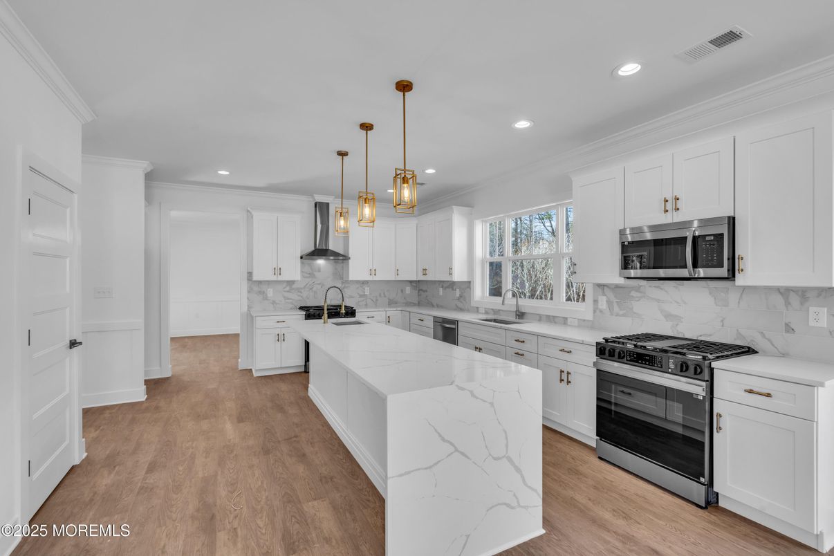 Interior, Kitchen, Marble Walls, Pendant Lights, Recessed Lighting, Stainless Steel Appliances, Wood Texture Flooring