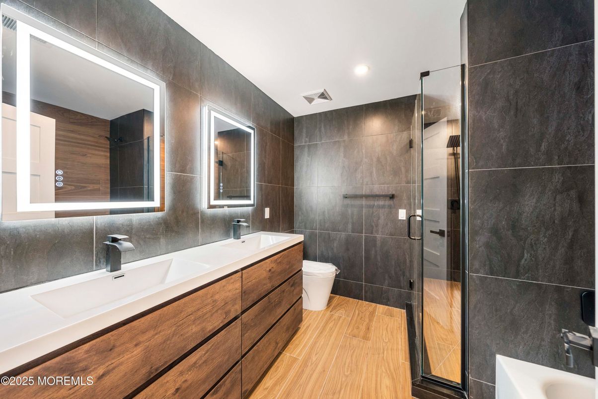 Bathroom, Dual Sink Vanities, Glass Shower, Interior, Recessed Lighting, Wood Texture Flooring