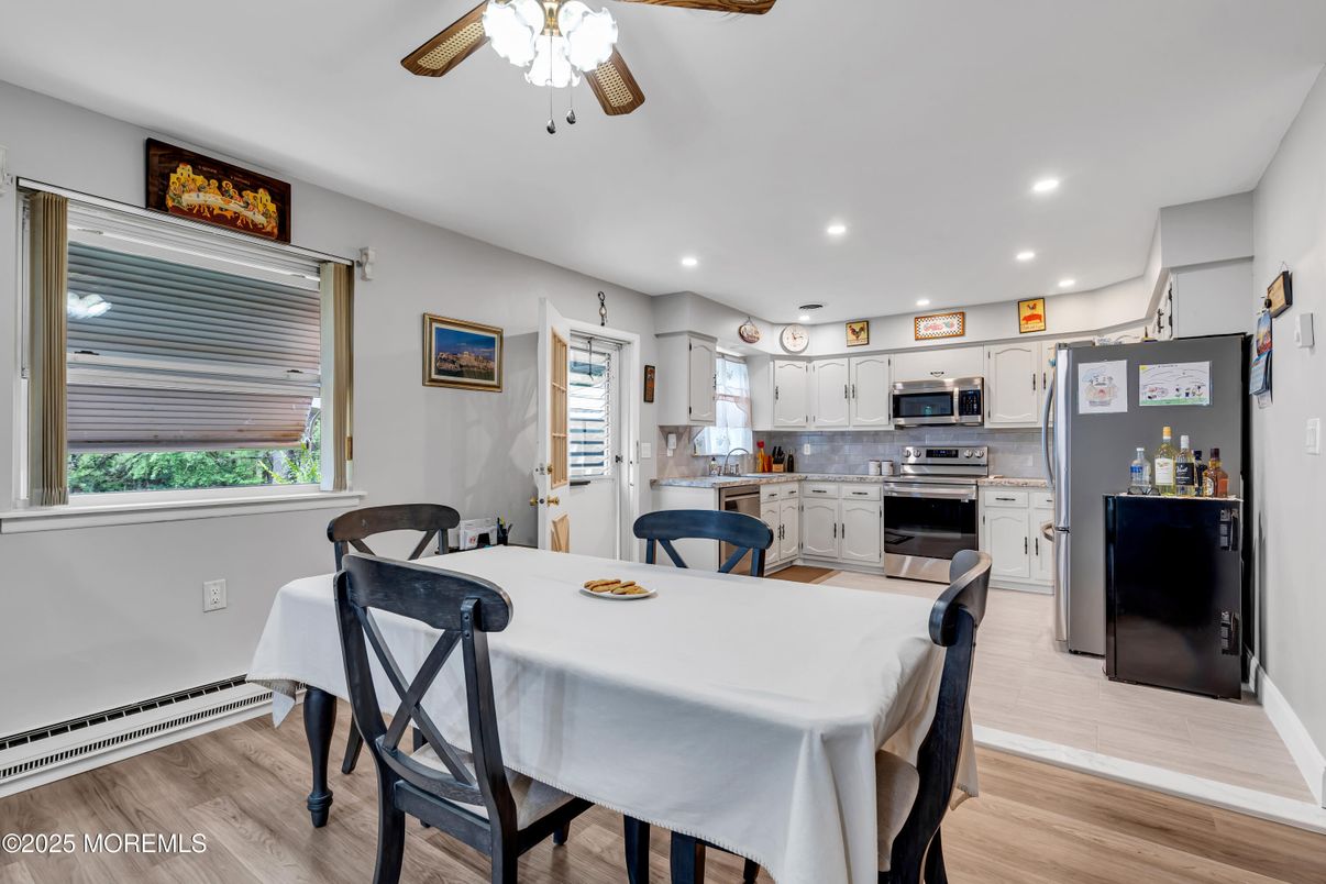 Dining room, Interior, Kitchen, Recessed Lighting, Stainless Steel Appliances, Wood Texture Flooring