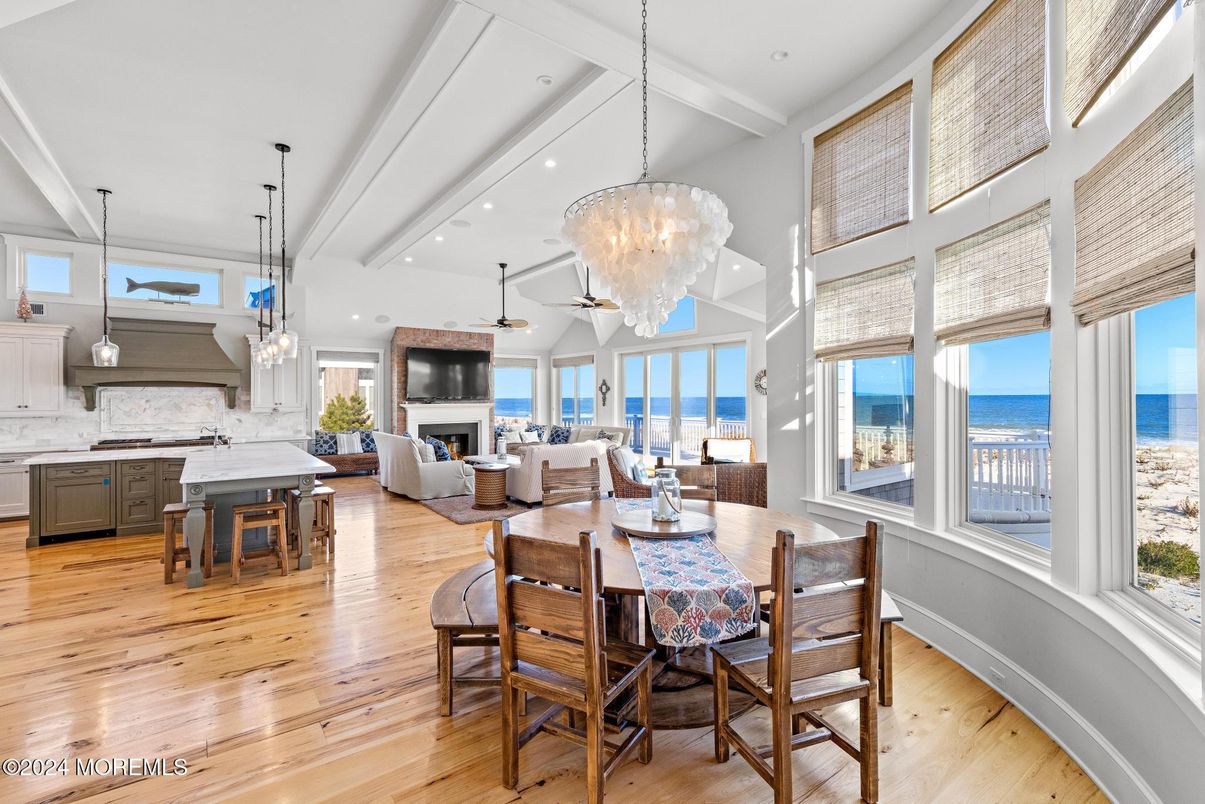 Chandelier, Dining room, Fireplace, Interior, Kitchen, Living room, Pendant Lights, Recessed Lighting, Water, Wood Texture Flooring