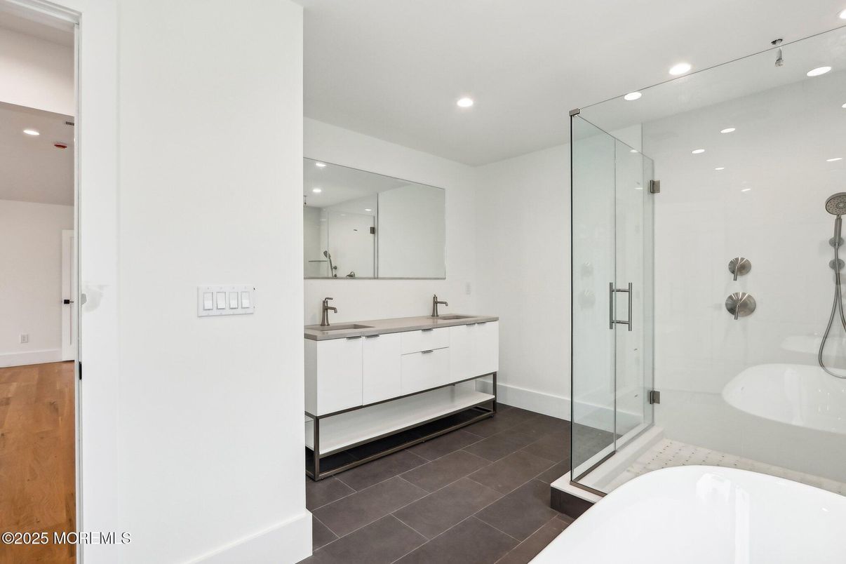 Bathroom, Dual Sink Vanities, Glass Shower, Interior, Recessed Lighting, Wood Texture Flooring