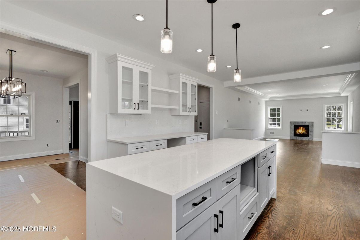 Empty room, Fireplace, Interior, Kitchen, Pendant Lights, Recessed Lighting, Wood Texture Flooring