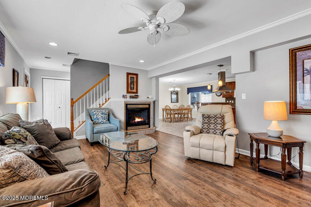 Chandelier, Dining room, Fireplace, Interior, Living room, Pendant Lights, Recessed Lighting, Wood Texture Flooring