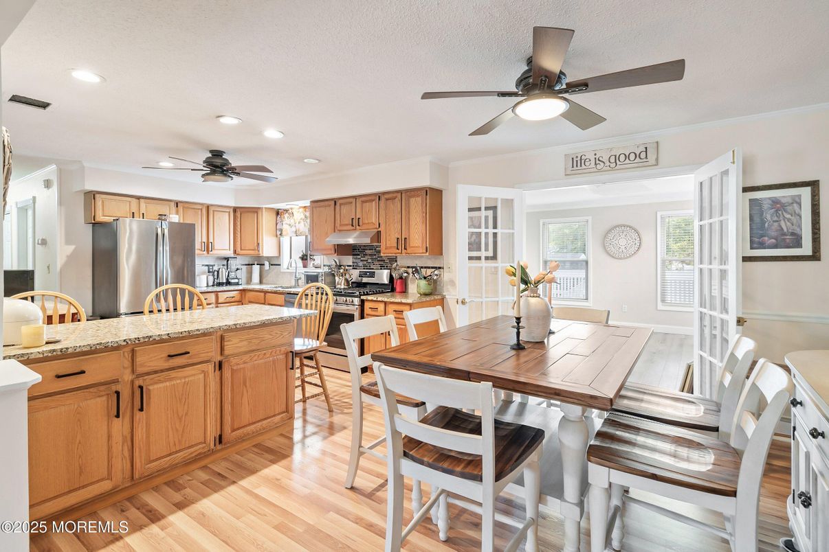 Dining room, Interior, Kitchen, Recessed Lighting, Stainless Steel Appliances, Wood Texture Flooring