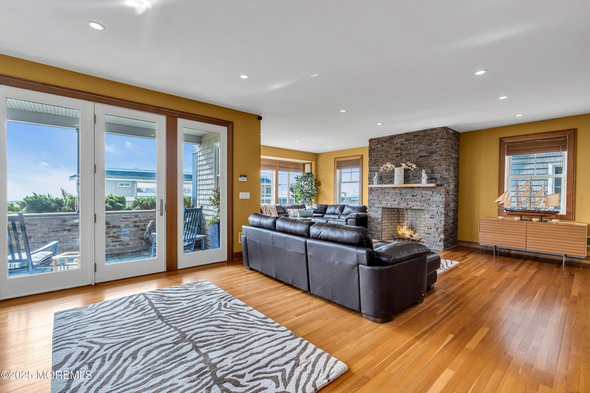 Fireplace, Interior, Living room, Recessed Lighting, Stone Walls, Wood Texture Flooring