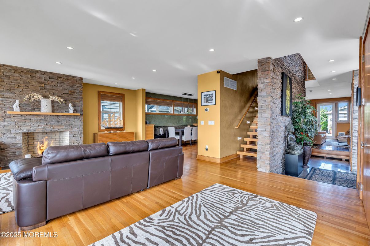 Fireplace, Interior, Living room, Recessed Lighting, Stone Walls, Wood Texture Flooring