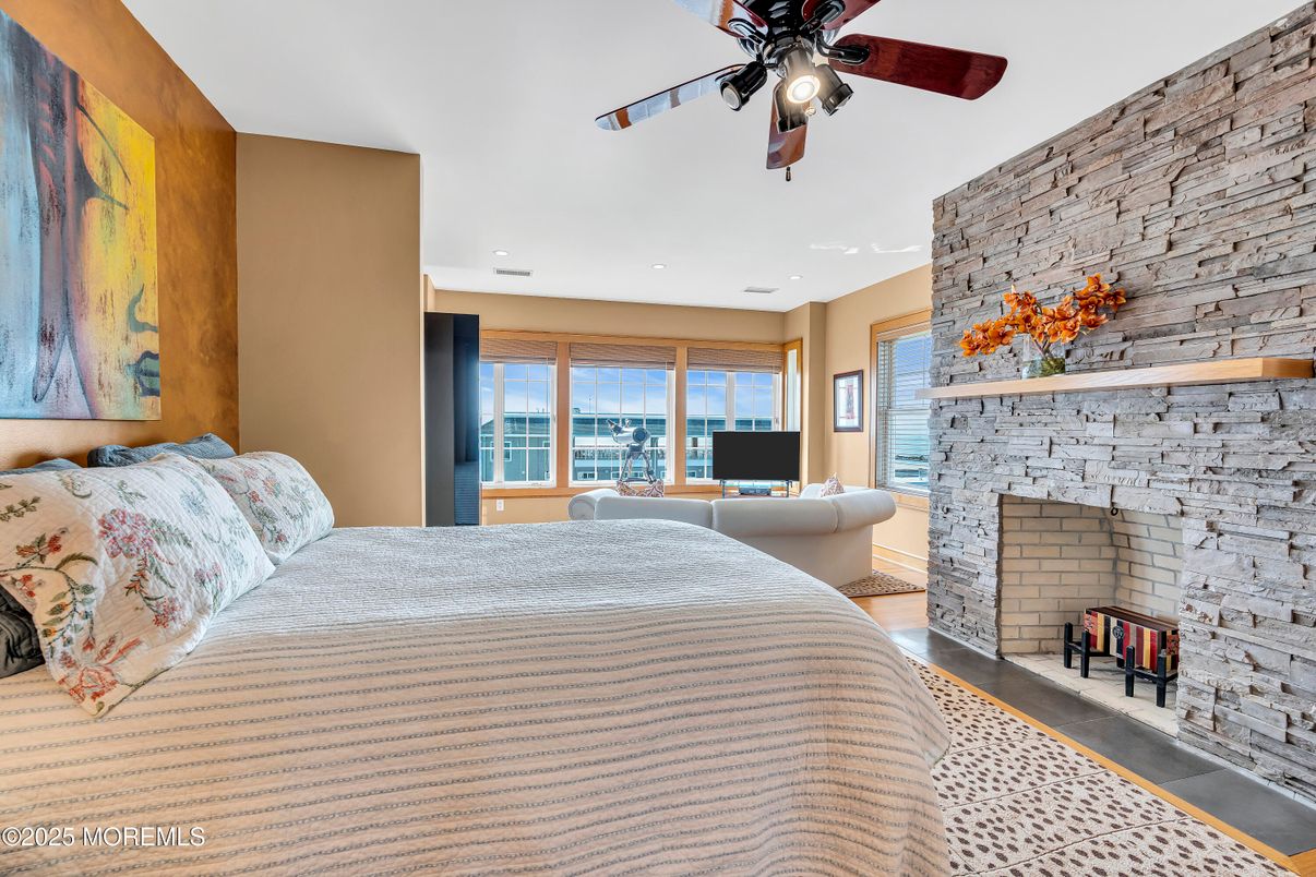 Bedroom, Fireplace, Interior, Recessed Lighting, Stone Walls, Wood Texture Flooring