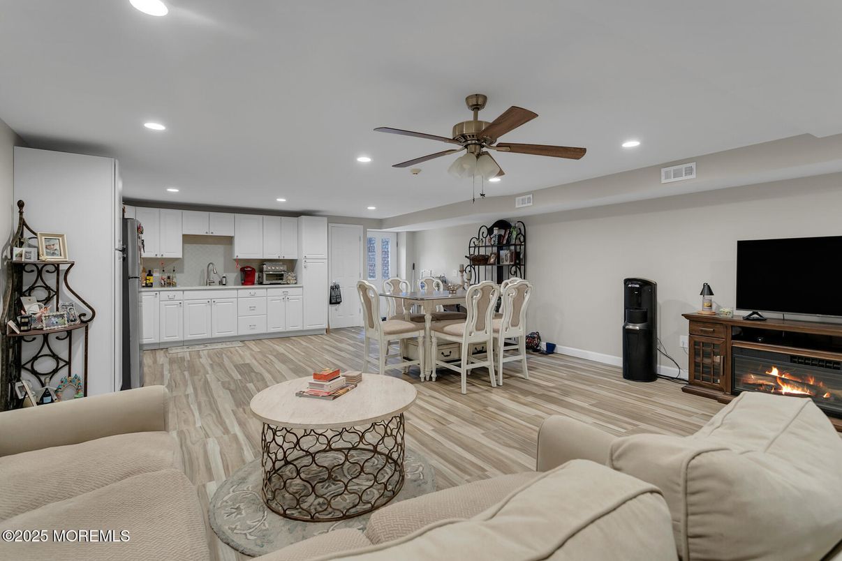 Dining room, Fireplace, Interior, Kitchen, Living room, Recessed Lighting, Wood Texture Flooring