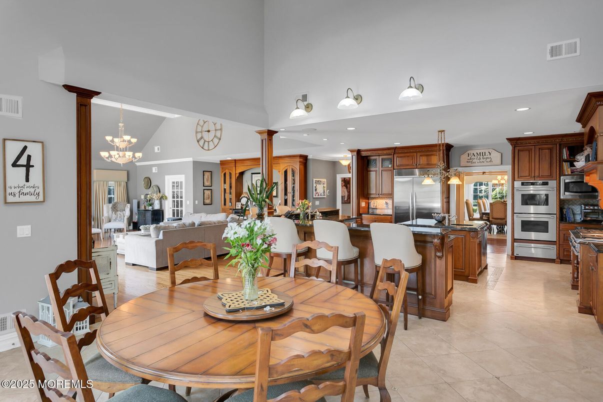 Chandelier, Dining room, Fireplace, Interior, Kitchen, Living room, Pendant Lights, Recessed Lighting, Stainless Steel Appliances