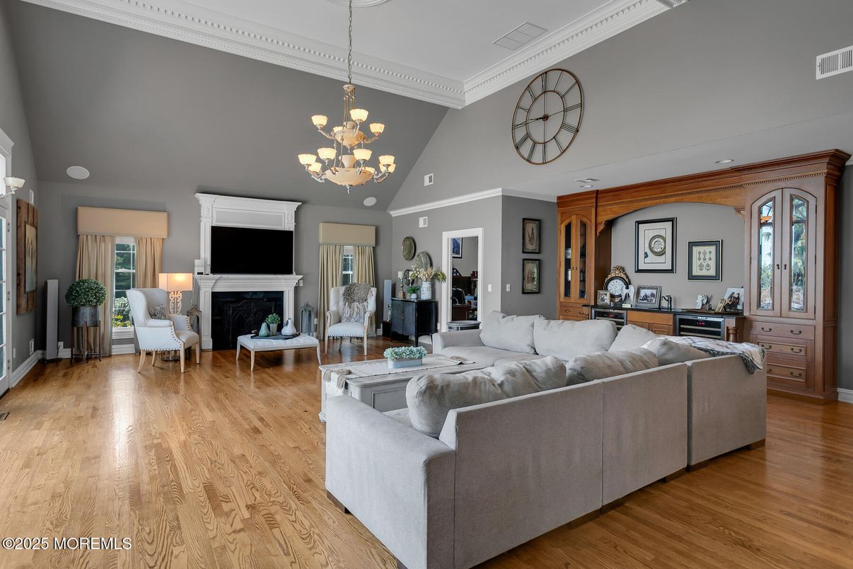 Chandelier, Fireplace, Interior, Living room, Recessed Lighting, Wood Texture Flooring