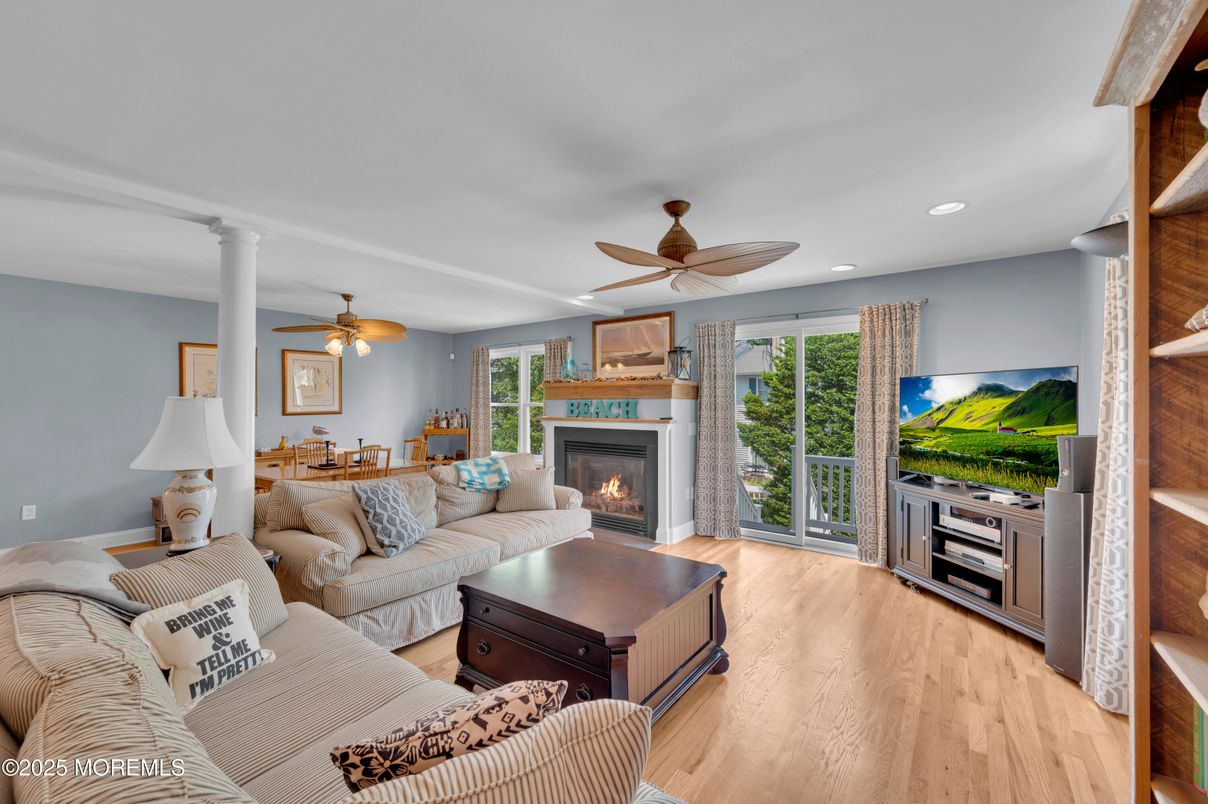 Dining room, Fireplace, Interior, Living room, Recessed Lighting, Wood Texture Flooring