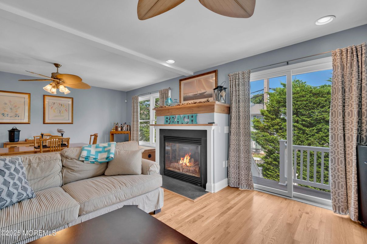 Dining room, Fireplace, Interior, Living room, Recessed Lighting, Wood Texture Flooring