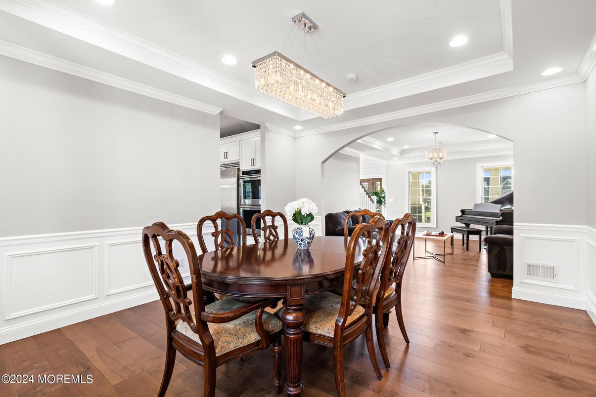 Chandelier, Dining room, Interior, Kitchen, Piano, Recessed Lighting, Stainless Steel Appliances, Wood Texture Flooring