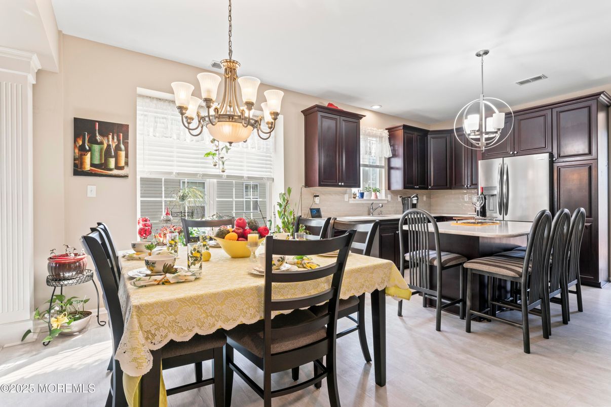 Chandelier, Dining room, Interior, Kitchen, Pendant Lights, Recessed Lighting, Stainless Steel Appliances, Wood Texture Flooring