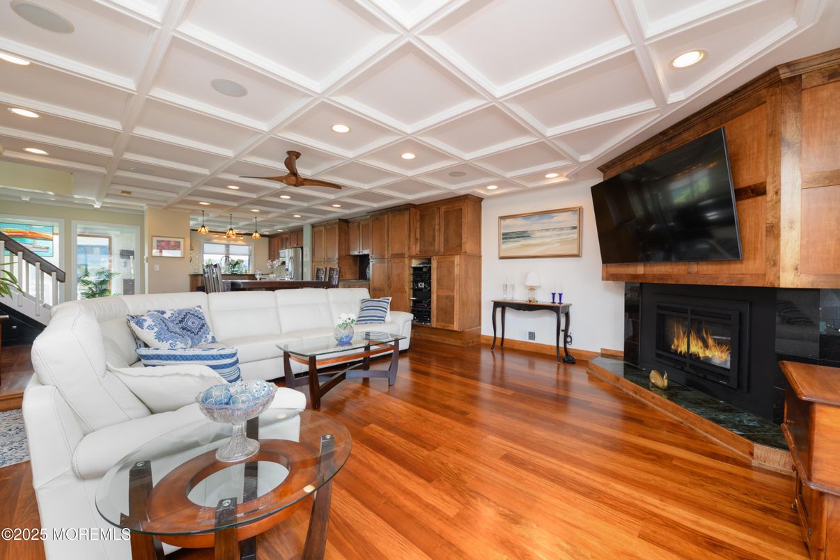 Fireplace, Interior, Living room, Pendant Lights, Recessed Lighting, Wood Texture Flooring, Wooden Walls